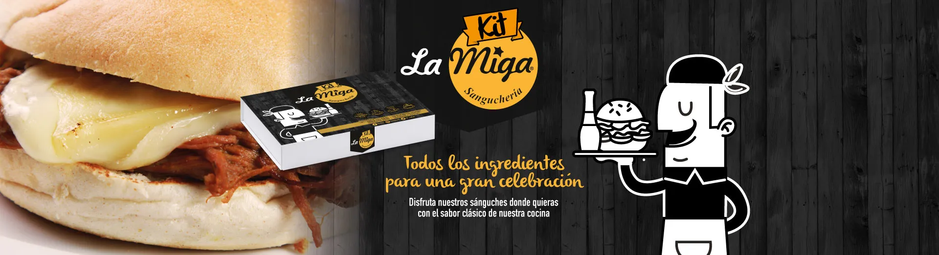 Primer plano de un sánguche de plateada con queso fundido, junto a la caja del Kit